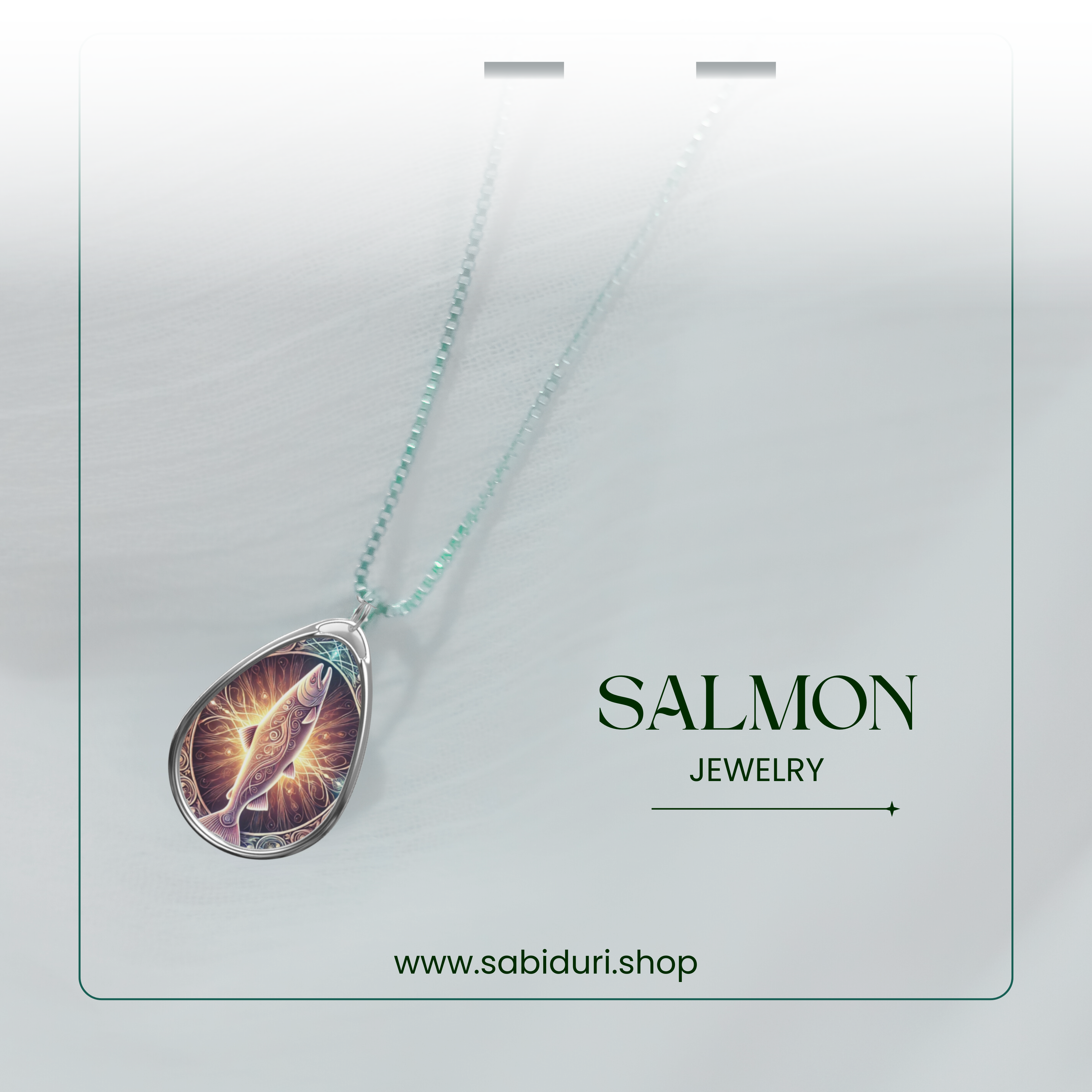 A stylish product display of the salmon necklace against a soft gradient background, featuring a shimmering teal chain. The text "SALMON JEWELRY" and "www.sabiduri.shop" is presented in a refined font.