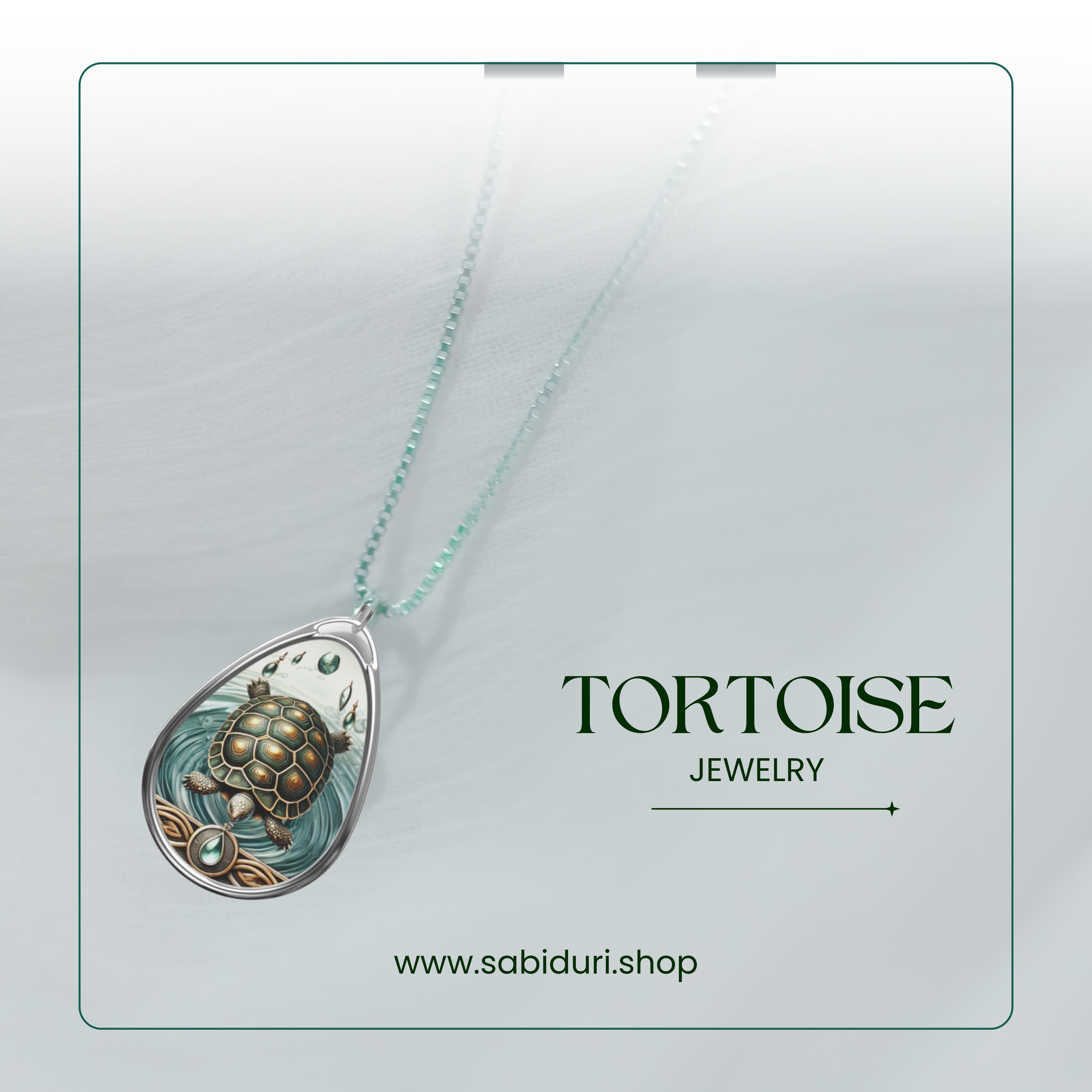 A minimalist presentation of a tortoise spirit animal necklace, displayed on a soft white background with subtle green tones. The text "TORTOISE JEWELRY" and "www.sabiduri.shop" is featured at the bottom, emphasizing the brand and product.