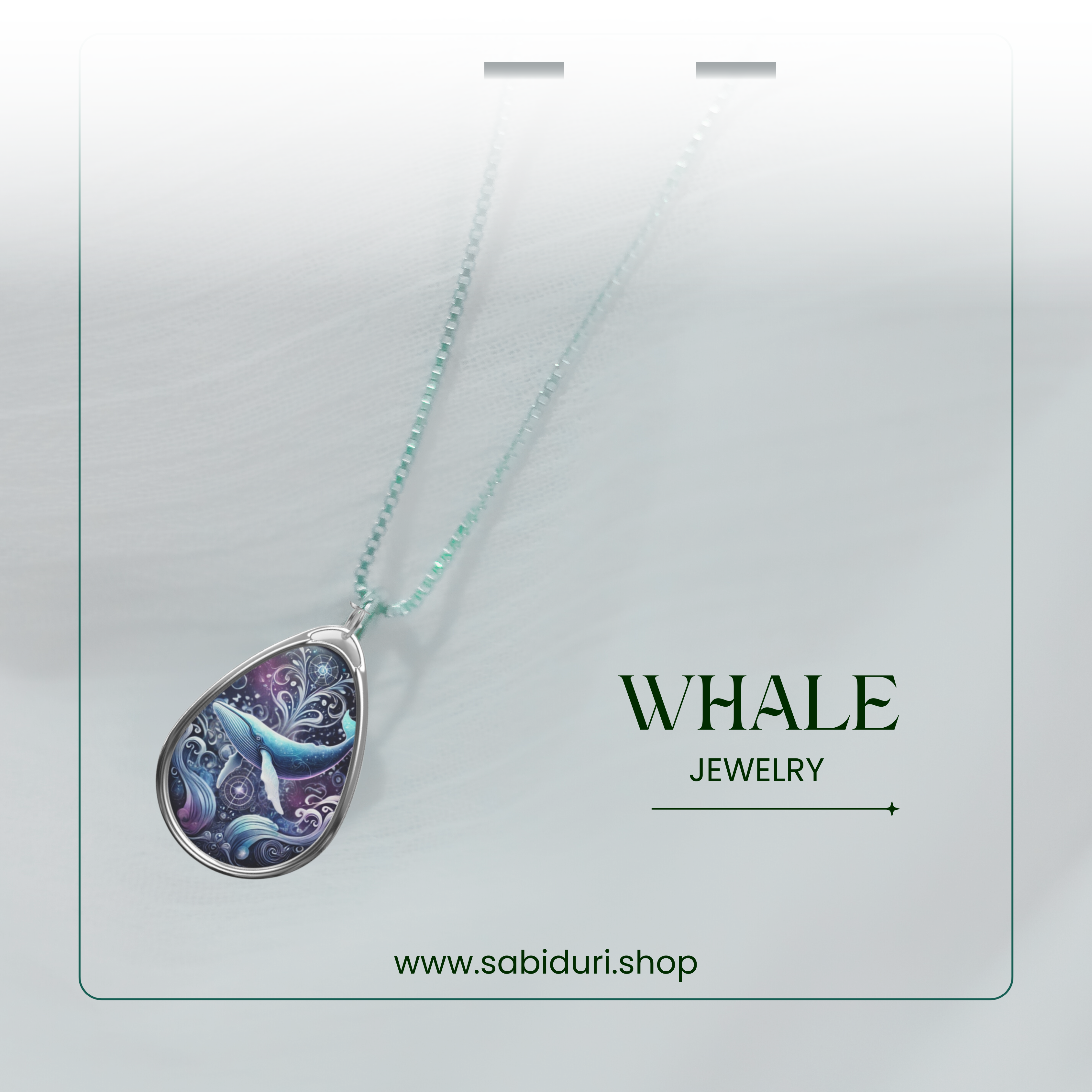 A whale pendant necklace elegantly displayed on a light, soft-textured background. The teardrop-shaped pendant showcases an artistic blue whale surrounded by swirling ocean waves and celestial elements, attached to a silver and beaded chain. The text includes 'WHALE' and 'JEWELRY', along with the website 'www.sabiduri.shop'.