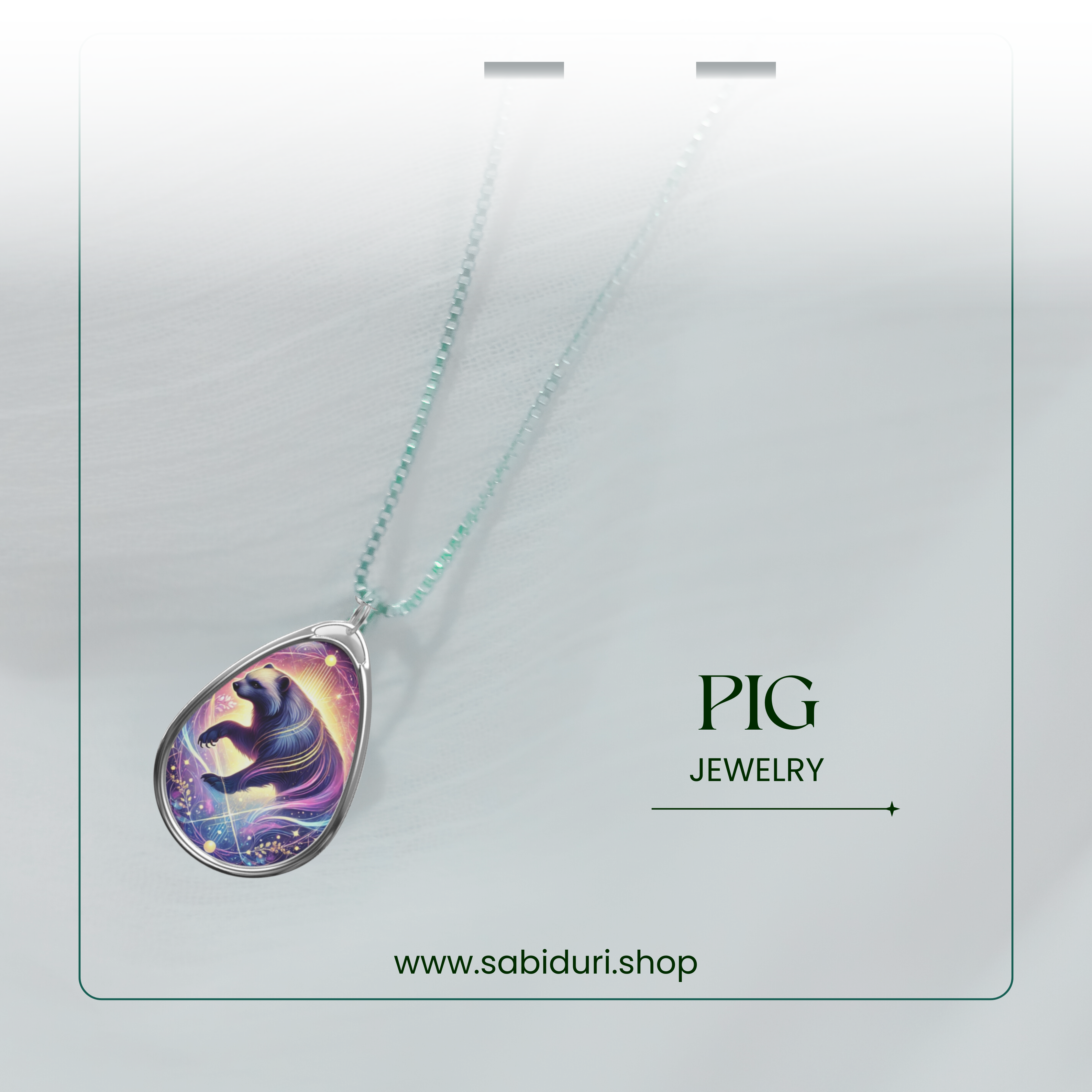 A close-up of the Wolverine pendant necklace with a silver frame and a celestial, glowing design, displayed against a softly blurred white background. "WOLVERINE JEWELRY" and "www.sabiduri.shop" are written in green text.