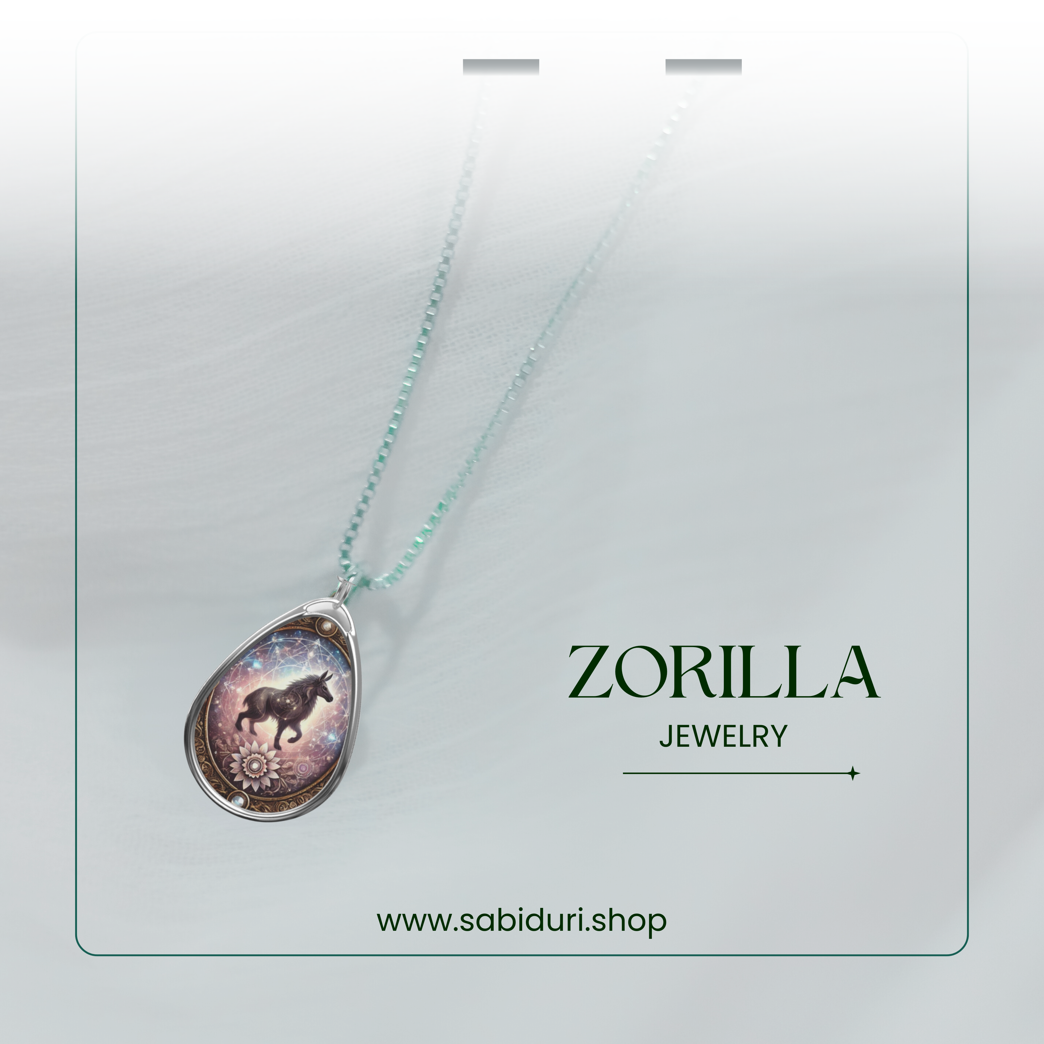 A close-up of the zorilla pendant hanging from a delicate chain, showcased against a soft, white background with a transparent card overlay. The words "ZORILLA JEWELRY" and "www.sabiduri.shop" are elegantly positioned.